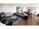 Open-concept living room with hardwood floors and a seamless connection to the kitchen at 7808 Grande Oaks Dr, Plainfield, IN 46168