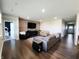 Spacious living room with hardwood floors, a comfortable sofa, and a welcoming atmosphere at 7808 Grande Oaks Dr, Plainfield, IN 46168