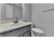 Well-lit bathroom features a sleek vanity with white countertop and modern fixtures at 7914 Willow Wind Cir, Indianapolis, IN 46239