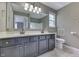 Bathroom with double sinks and a large mirror at 7914 Willow Wind Cir, Indianapolis, IN 46239
