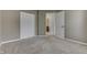 Bedroom includes closet and access to full bathroom, neutral carpet and walls at 7914 Willow Wind Cir, Indianapolis, IN 46239