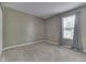 Bedroom featuring plush carpet, neutral paint, and a window with stylish curtains at 7914 Willow Wind Cir, Indianapolis, IN 46239