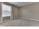 Bedroom features neutral carpet, paint, and a large window bringing in lots of natural light at 7914 Willow Wind Cir, Indianapolis, IN 46239
