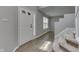 Bright and inviting foyer featuring hardwood floors, a staircase, and a welcoming front door at 7914 Willow Wind Cir, Indianapolis, IN 46239