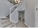 Spacious foyer with staircase, high ceilings, and modern gray walls at 7914 Willow Wind Cir, Indianapolis, IN 46239