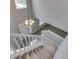 Inviting foyer featuring a chandelier, staircase, and view of the front door at 7914 Willow Wind Cir, Indianapolis, IN 46239