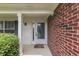 Close-up of a well-maintained front entrance with a white-framed door and brick accents at 7914 Willow Wind Cir, Indianapolis, IN 46239