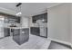 Modern kitchen features an island with bar stool seating and stainless steel appliances at 7914 Willow Wind Cir, Indianapolis, IN 46239