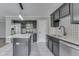 Stylish kitchen featuring granite countertops, an island, stainless steel appliances, and eye-catching backsplash at 7914 Willow Wind Cir, Indianapolis, IN 46239