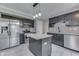 Modern kitchen boasts stainless steel appliances, granite counters, and a stylish black and white backsplash at 7914 Willow Wind Cir, Indianapolis, IN 46239