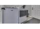 Bright laundry room featuring modern appliances and ample space at 7914 Willow Wind Cir, Indianapolis, IN 46239