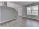 Inviting living room with large window and open access to the staircase and front door at 7914 Willow Wind Cir, Indianapolis, IN 46239