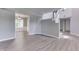 Spacious living area with seamless flow into the dining area, featuring modern flooring at 7914 Willow Wind Cir, Indianapolis, IN 46239