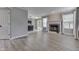 Living room featuring fireplace and open-concept layout flowing into the kitchen and dining area at 7914 Willow Wind Cir, Indianapolis, IN 46239