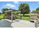 Outdoor living space with a pergola sitting area overlooking the backyard of this home at 8030 5 Points Rd, Indianapolis, IN 46259