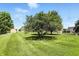 Large well-maintained backyard with mature trees and a storage shed at 8030 5 Points Rd, Indianapolis, IN 46259