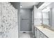 Clean bathroom features granite countertops, decorative mirrors and shower with curtain at 8030 5 Points Rd, Indianapolis, IN 46259
