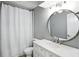 Bathroom with a white vanity, mirror, toilet, and shower with white curtain at 8030 5 Points Rd, Indianapolis, IN 46259
