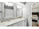 Bright bathroom featuring granite countertops, double sinks and a decorative shower curtain at 8030 5 Points Rd, Indianapolis, IN 46259
