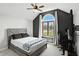 Bedroom featuring vaulted ceiling, natural light, carpet, and stylish furnishings at 8030 5 Points Rd, Indianapolis, IN 46259