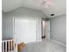 A Bedroom featuring vaulted ceilings, a closet with folding doors and neutral gray walls at 8030 5 Points Rd, Indianapolis, IN 46259