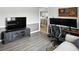 The living room has a grey accent wall with a mounted TV and a view of the kitchen through the doorway at 8030 5 Points Rd, Indianapolis, IN 46259