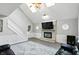 Inviting living room with vaulted ceilings, a fireplace, a staircase, and luxury vinyl plank flooring at 8030 5 Points Rd, Indianapolis, IN 46259