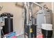 Utility area showcasing the furnace, water heater, and water softener, ensuring home systems' maintenance at 9046 Sparta Dr, Fishers, IN 46038
