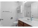 Well-lit bathroom featuring a mirrored vanity, toilet, and shower with glass doors, offering a functional space at 9046 Sparta Dr, Fishers, IN 46038