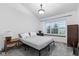 Cozy bedroom featuring a bed, built-in window bench, and carpeted floors at 9046 Sparta Dr, Fishers, IN 46038