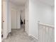 Upstairs hallway with neutral carpet and white doors, leading to the various rooms of the house at 9046 Sparta Dr, Fishers, IN 46038