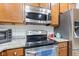 Updated kitchen featuring stainless steel appliances and granite countertops, providing a modern and functional space at 9046 Sparta Dr, Fishers, IN 46038