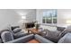 Cozy living room with plush seating, natural light, modern decor, and a comfortable ambiance at 9046 Sparta Dr, Fishers, IN 46038