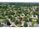 Wide aerial of a residential neighborhood with lush trees and well manicured lawns near a golf course at 9170 Andiron Way, Indianapolis, IN 46250
