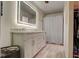 Bathroom with stylish vanity, sleek mirror, and modern shower curtain at 9170 Andiron Way, Indianapolis, IN 46250
