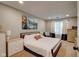 Well-lit main bedroom with a comfortable bed, large window, and dresser at 9170 Andiron Way, Indianapolis, IN 46250