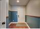 Foyer with hardwood floors, wainscoting detail, and a neutral color palette at 9170 Andiron Way, Indianapolis, IN 46250