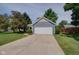 Inviting exterior featuring well-kept lawn, driveway, and a two-car garage with blue siding at 9170 Andiron Way, Indianapolis, IN 46250