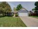 Charming single-Gathering home with blue siding, a two-car garage, and a well-manicured front yard at 9170 Andiron Way, Indianapolis, IN 46250