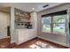 Modern kitchen bar area with wooden shelves and a large window providing natural light at 9170 Andiron Way, Indianapolis, IN 46250