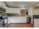 Bright kitchen featuring white cabinets, stainless steel appliances, and stylish backsplash at 9170 Andiron Way, Indianapolis, IN 46250