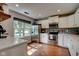 Updated kitchen with stainless steel appliances, white cabinetry, and a bright window at 9170 Andiron Way, Indianapolis, IN 46250