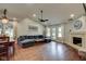 Spacious living area features wood flooring, fireplace, and access to the patio at 9170 Andiron Way, Indianapolis, IN 46250