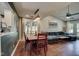 Open-concept living and dining area with hardwood floors and vaulted ceilings at 9170 Andiron Way, Indianapolis, IN 46250