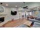 Open-concept living room with a fireplace, dining area and television for entertainment at 9170 Andiron Way, Indianapolis, IN 46250