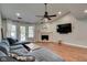 Comfortable living room featuring vaulted ceiling, fireplace, and modern amenities at 9170 Andiron Way, Indianapolis, IN 46250