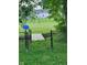 A quaint bridge over a creek gives access to the expansive backyard at 922 Eagle Brook Dr, Shelbyville, IN 46176