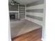 Cozy living room features a brick fireplace, white built-in shelves, and horizontally striped accent wall at 922 Eagle Brook Dr, Shelbyville, IN 46176