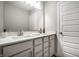 Double sink vanity featuring a quartz countertop and modern fixtures in a bright, neutral bathroom at 9407 Casey Rd, Pendleton, IN 46064