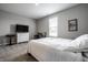 Serene bedroom with a white dresser, neutral walls, and plush carpet flooring at 9407 Casey Rd, Pendleton, IN 46064